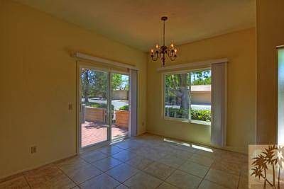Dining area, notice the large neutral tile in all areas except bedrooms.