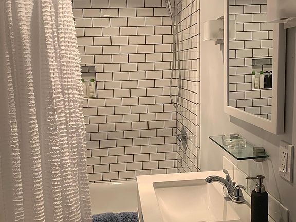 Full bath with porcelain tub. Newly renovated.