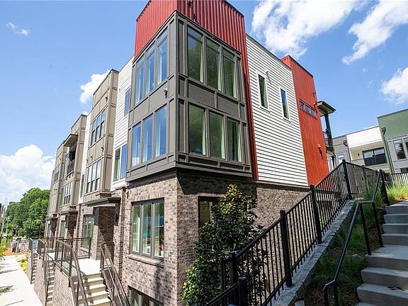 EXTERIOR PHOTOGRAPH of one building in community. Edgewood floor plan LOT 1506 is always a 3-story