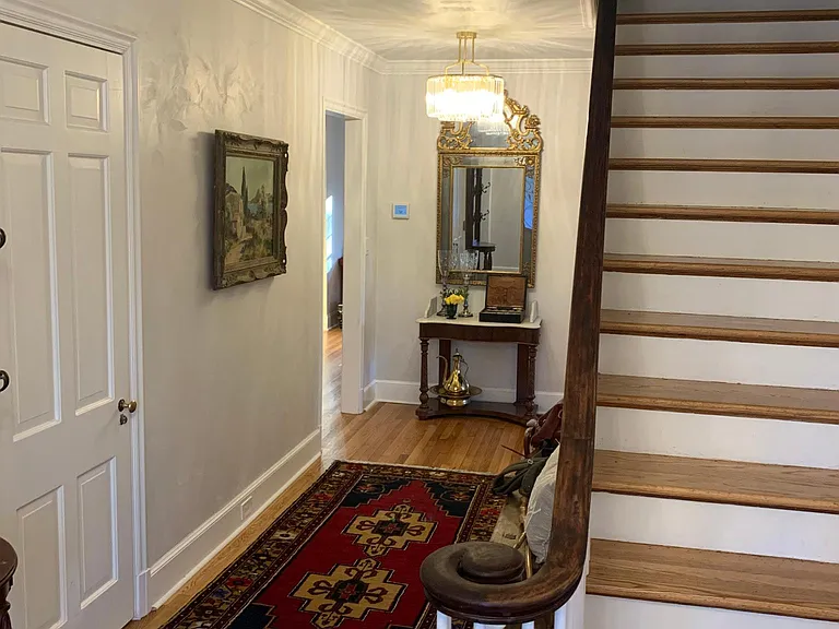 Front foyer and stairway leading to upstairs 5 bedrooms & 3 full bathrooms