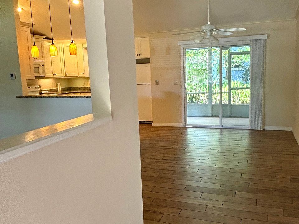 From Front Door looking at Kitchen (left) and Dining Area and back porch