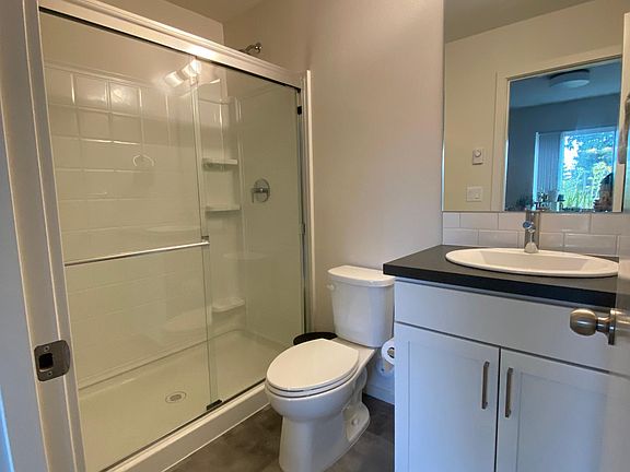First floor bedroom private bath. Standing shower, toilet, sink with tons of storage space