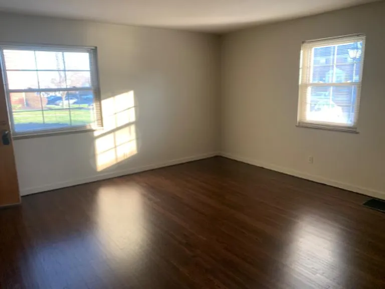 Large Living room with three windows for lots of light.