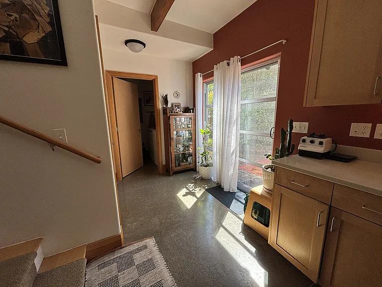 Sliding door to back patio. Separate laundry room (with brand new washer and dryer) and separate two-door pantry closet.