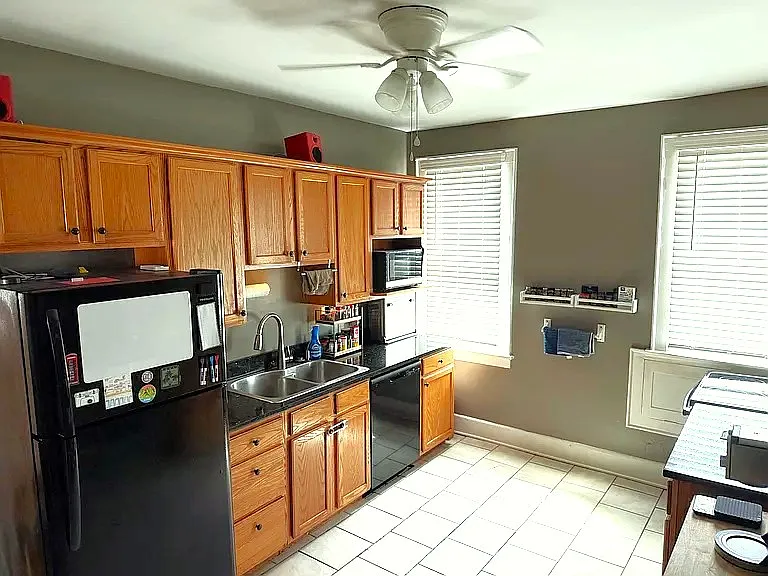 Large Kitchen with granite counter tops, stainless steel sink, full size fridge, dishwasher, electric range/oven and microwave.