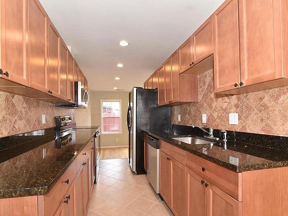 Kitchen w/ view of living room