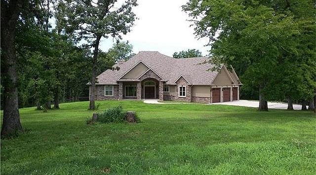 Rock and Stucco Finishes this One-of-a-kind house in the woods.