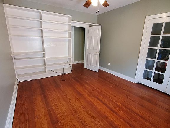 Bedroom w/ beautiful built-ins and French doors