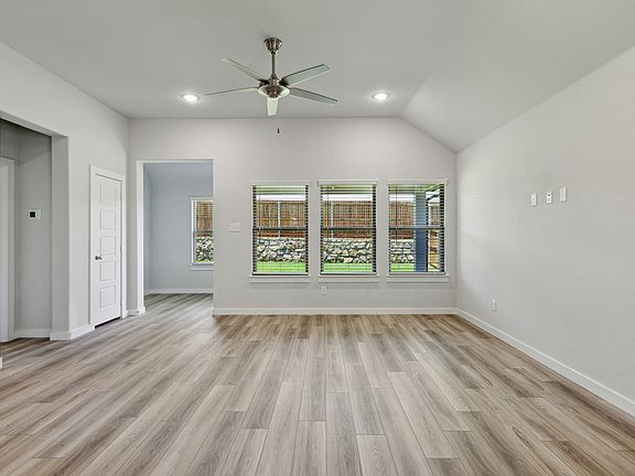 Living Room in the Quartz home plan by Trophy Signature Homes - REPRESENTATIVE PHOTO
