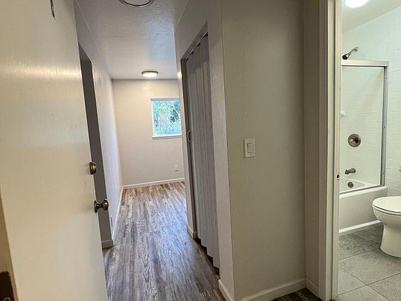 Entry Hallway to bathroom, Kitchen, and Living room
