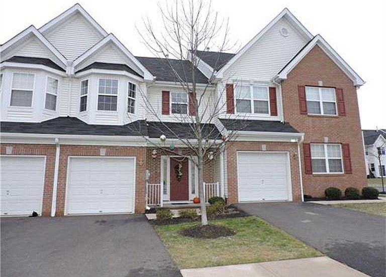 Front of home with view of driveway