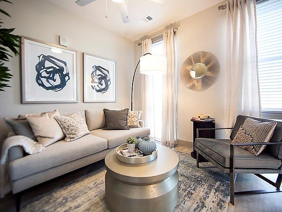 Living room - floor to ceiling windows, ceiling fan with light dimmer, plank flooring through out. Great city views and light!