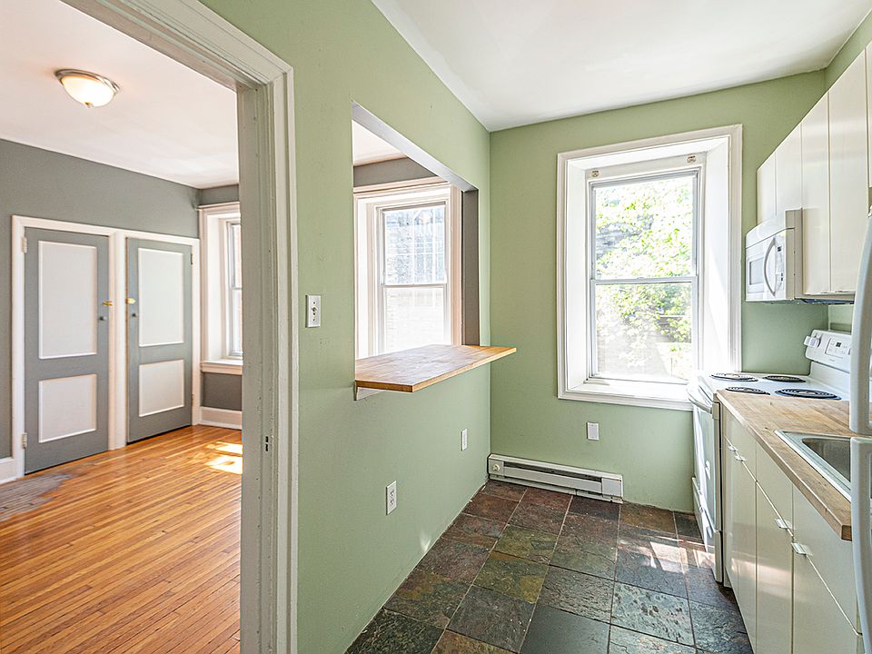 Kitchen with butcher block countertops and great light.