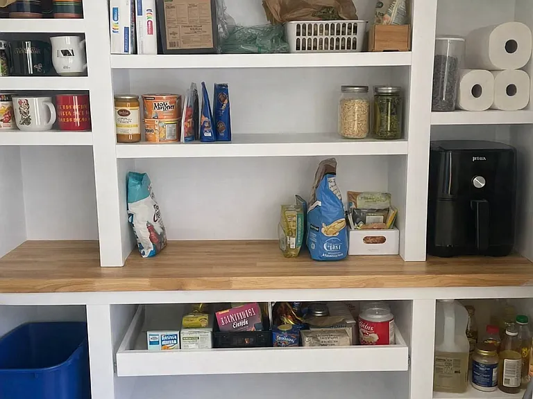 Custom built-in pantry with sliding doors not pictured