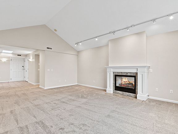 Living room looking to front door and Foyer.