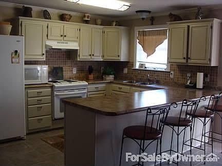 Cabinets repainted, counters tops changed, kitchen repainted in last few months