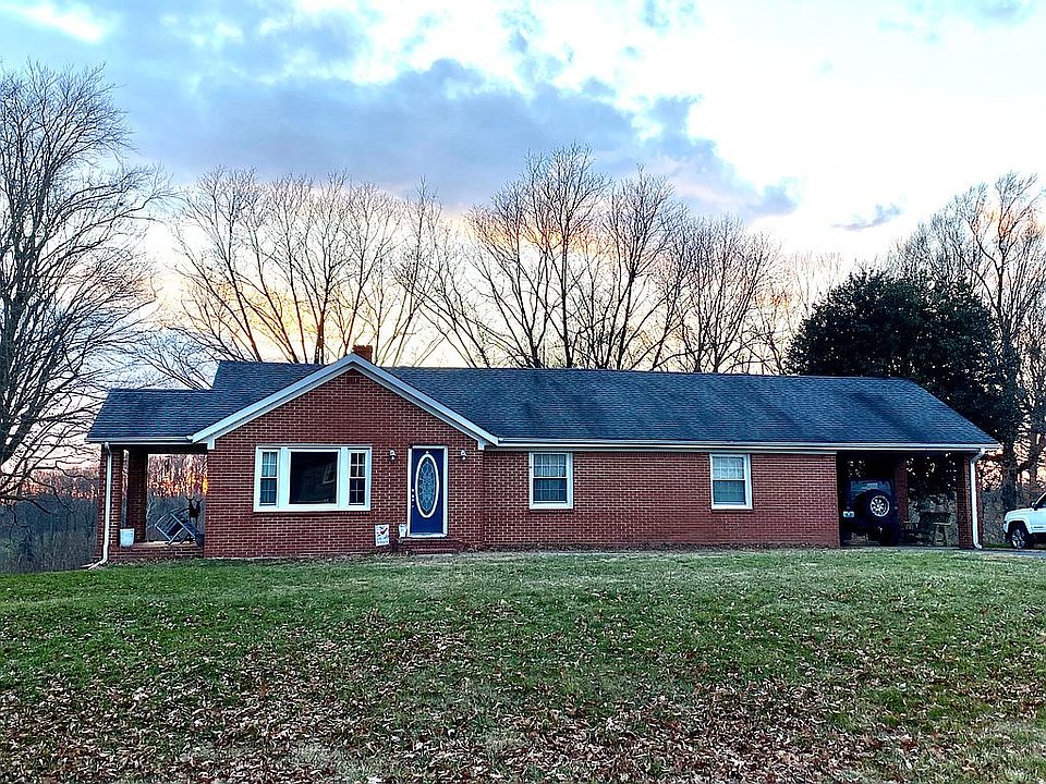 Carport with blacktop drive