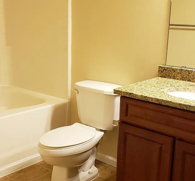 Bathroom is upgraded with high sink and granite countertop
Tile flooring