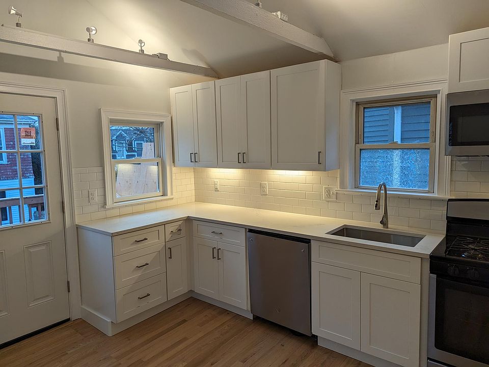 Kitchen w/ door to private deck