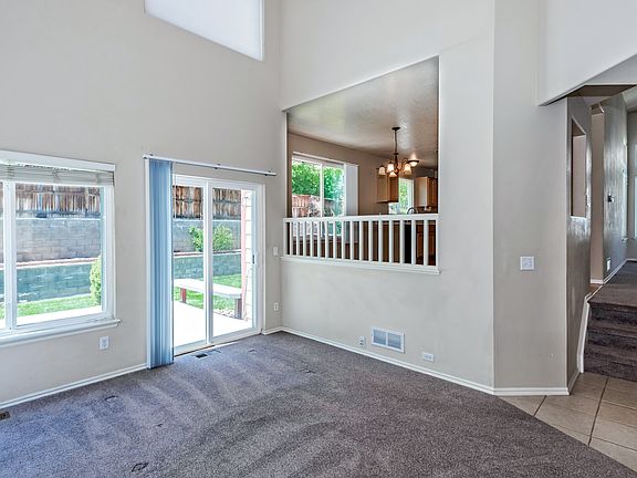 Opens to dining and kitchen