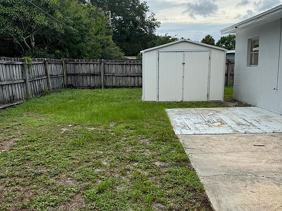 Fenced backyard w shed