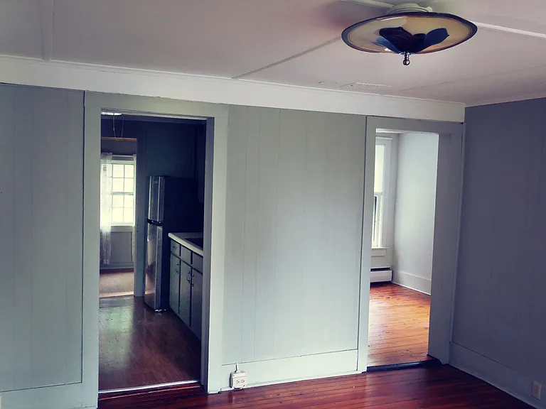 Our photos of living room. Kitchen on left, bedroom on right.