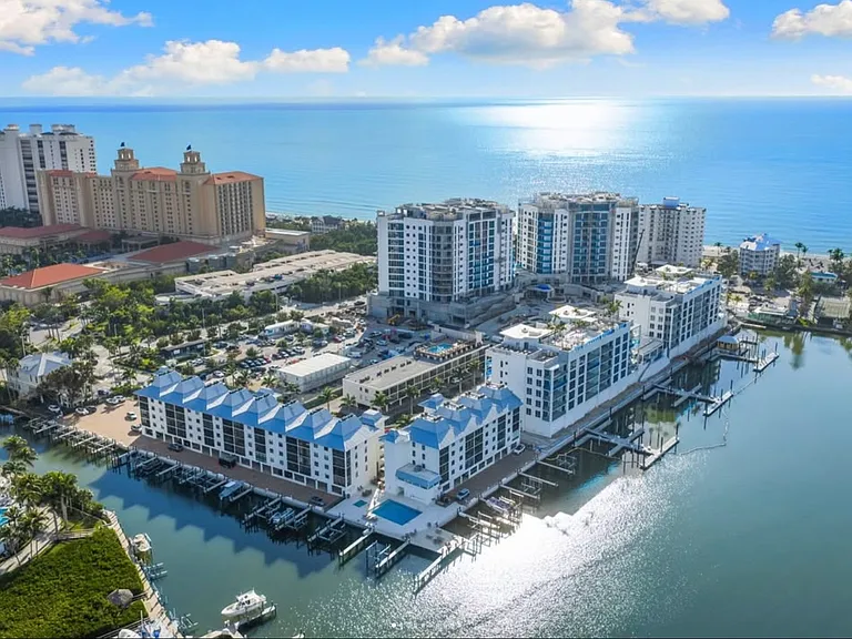 2nd floor corner unit over looking pool and Vanderbilt Bay w/private boat lift (boat rental available) - just a short stroll to Vanderbilt Beach, The Ritz Carlton and La Playa beach resorts offering all day dining and sunset cocktails every evening.