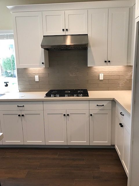 Five Burner Gas Cooktop with Hood and Beautiful Glass Tile Backsplash