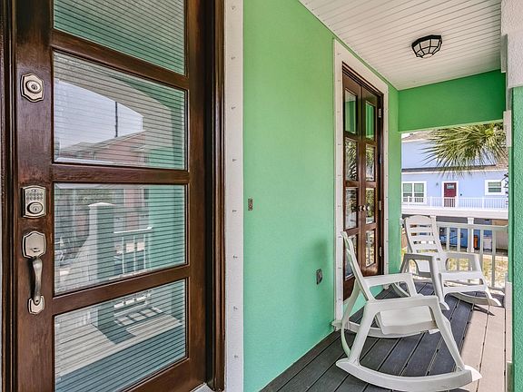 Front porch with four rocking chairs