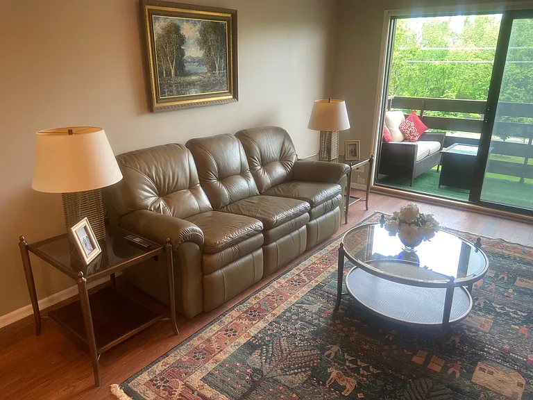 Living room with leather reclining couch to relax on