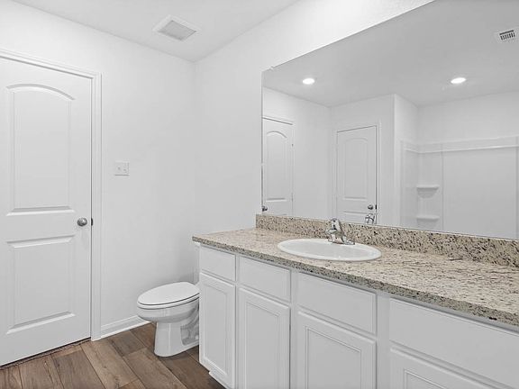 The master bath vanity offers a ton of space for getting ready.
