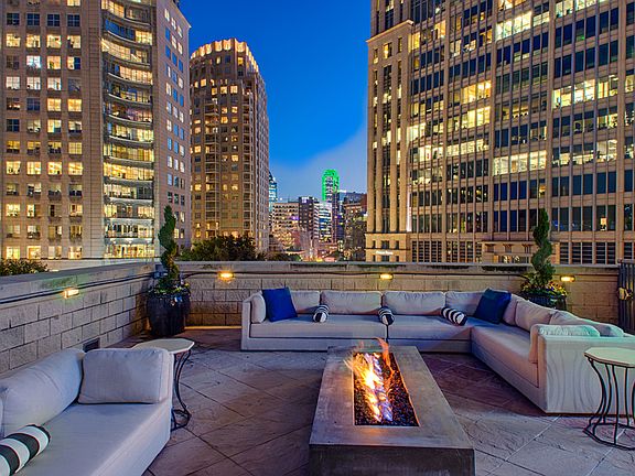 Luxury Rooftop Aqua Lounge with firepit and outdoor seating
