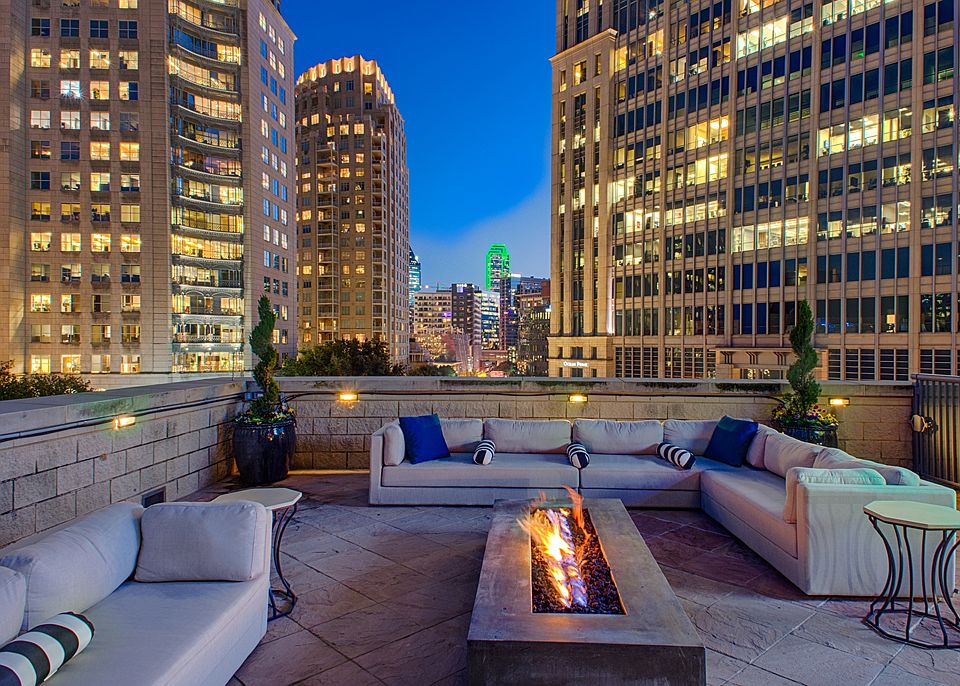 Luxury Rooftop Aqua Lounge with firepit and outdoor seating