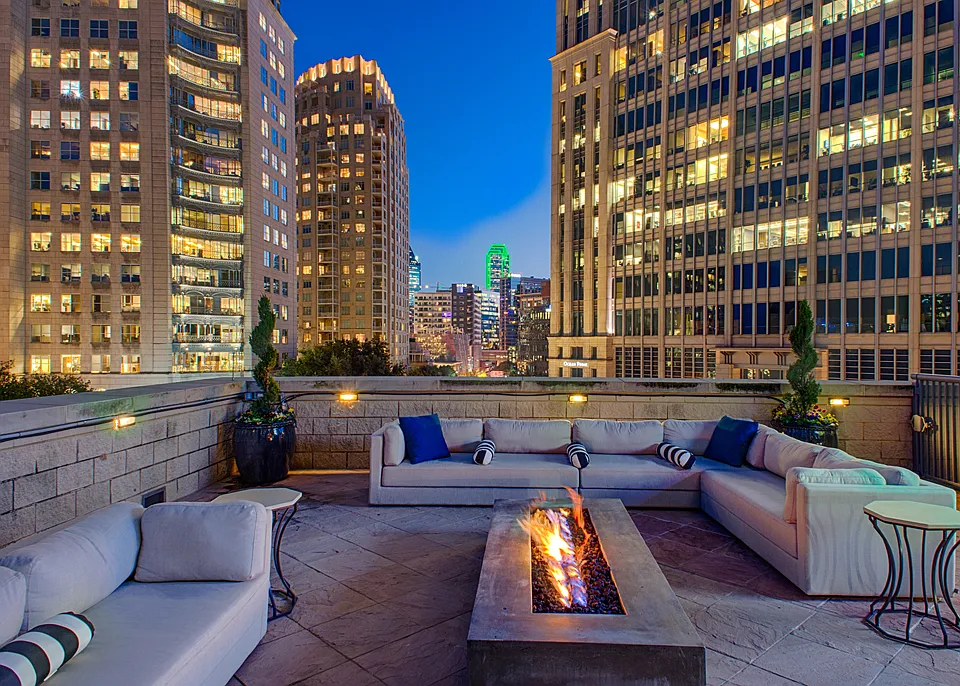 Luxury Rooftop Aqua Lounge with firepit and outdoor seating