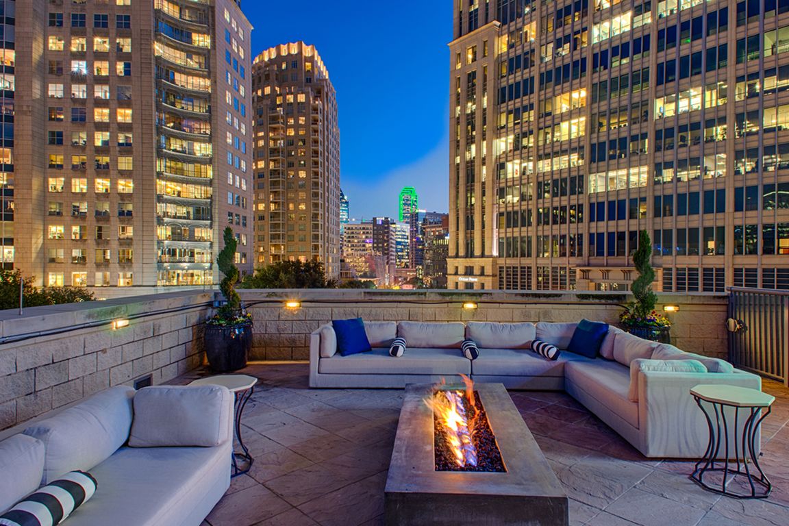 Luxury Rooftop Aqua Lounge with firepit and outdoor seating