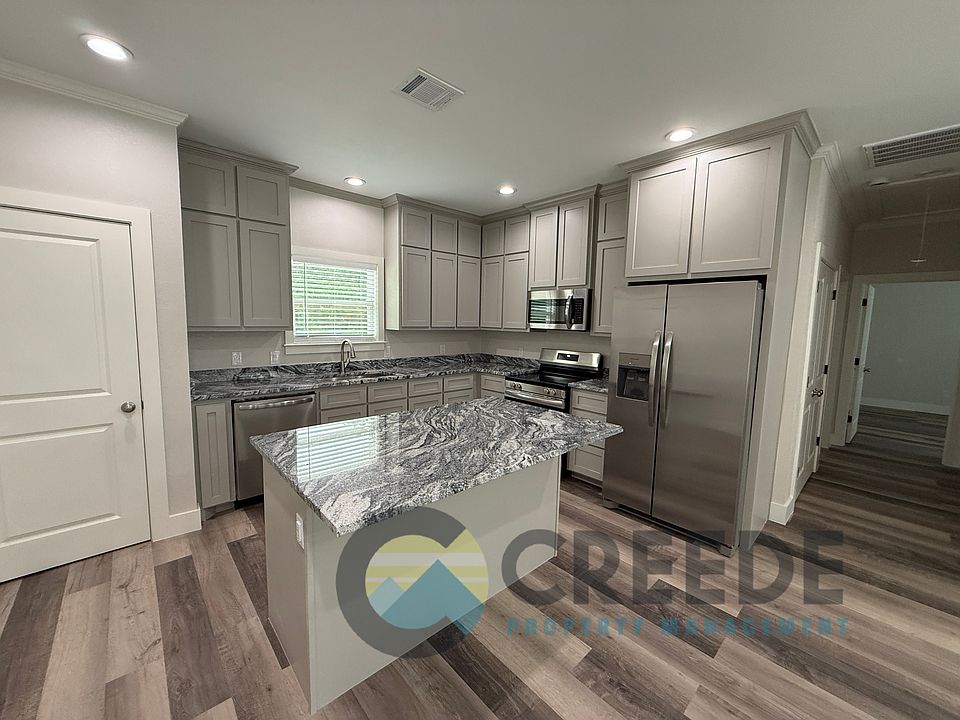 granite counter tops, custom cabinets, and stainless steel appliances