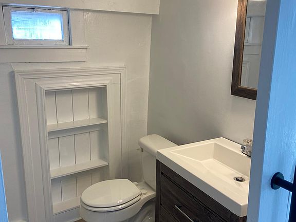Updated bathroom with shower and new vanity.