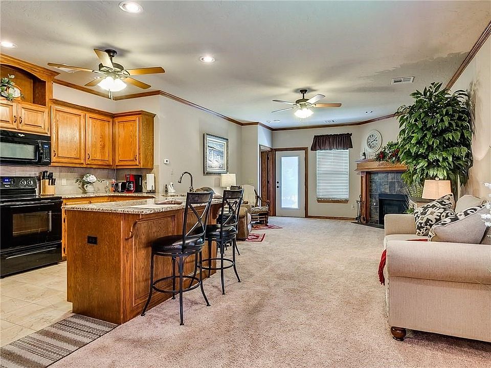 Open concept with beautiful oak woodwork and crown moldings.