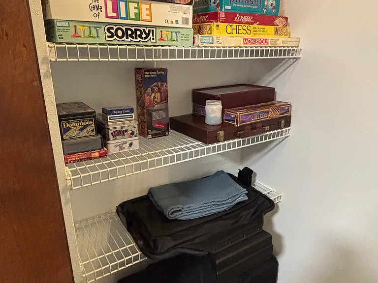 Bedroom #3 closet with games.
