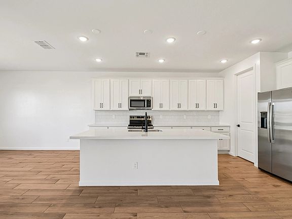 Kitchen featuring the Harmony Collection. Not actual home, finishes may vary by community.