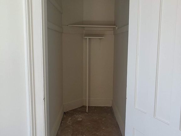 Deep walk in closet off the living room/kitchen space.