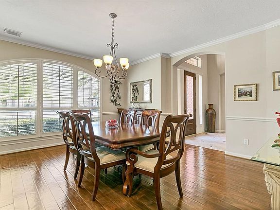 Plantation shutters and crown molding all around.