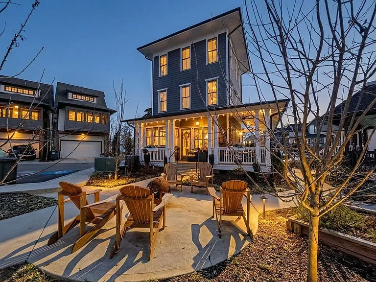 Front entrance at night - one of several fire pit with seating areas nearby