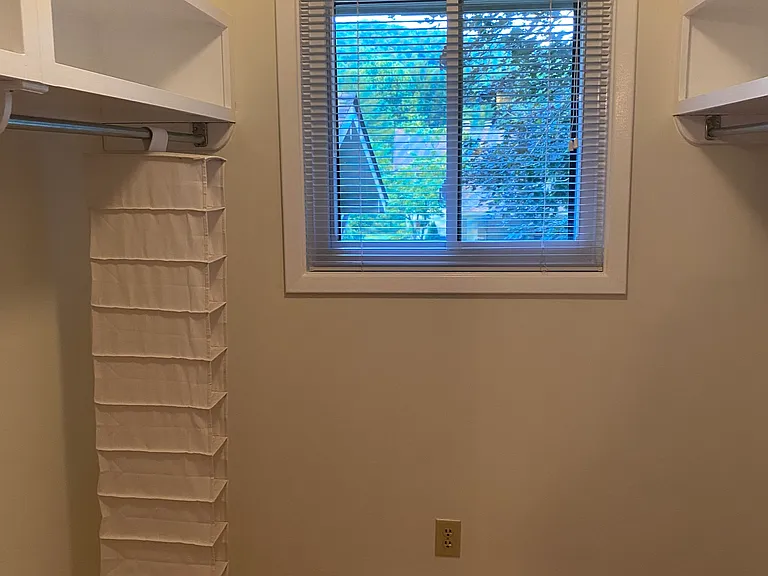Walk-in closet in master bedroom.