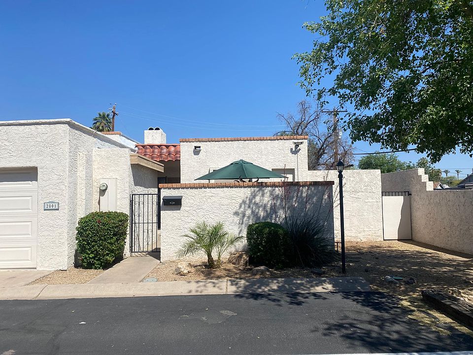 front entrance; patio; 2 car garage; end unit