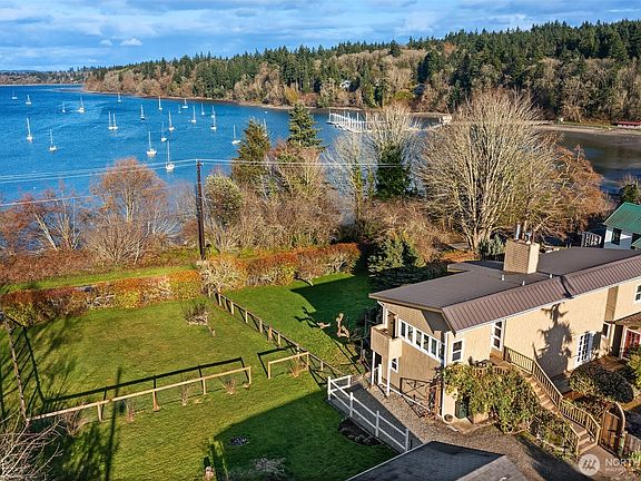 Home sits on almost 1/2 an acre w/ mature fruit trees, full fenced areas, and endless garden opportunities. Plus look at that view!>