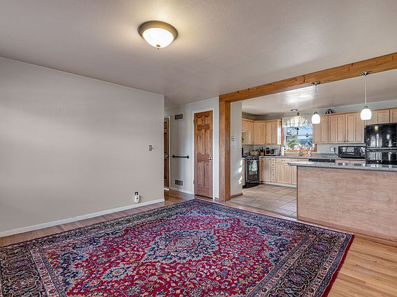 Main living room looking into kitchen