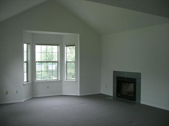 Living room with bay window and fireplace