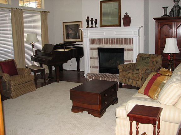 living room windows look out onto covered porch