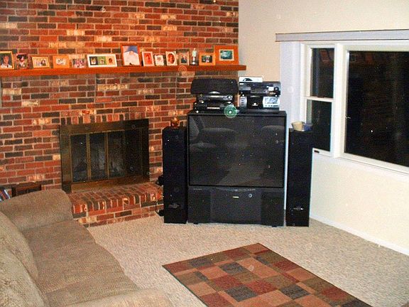 Family Room w/lg piture winodw & cozy wood burning fireplace w/Berber carpet!